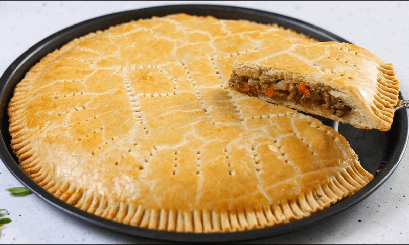 Kikifoodies Presents Day One of “25 Days of Christmas Recipes” featuring a Delicious Giant Meat Pie | Watch
